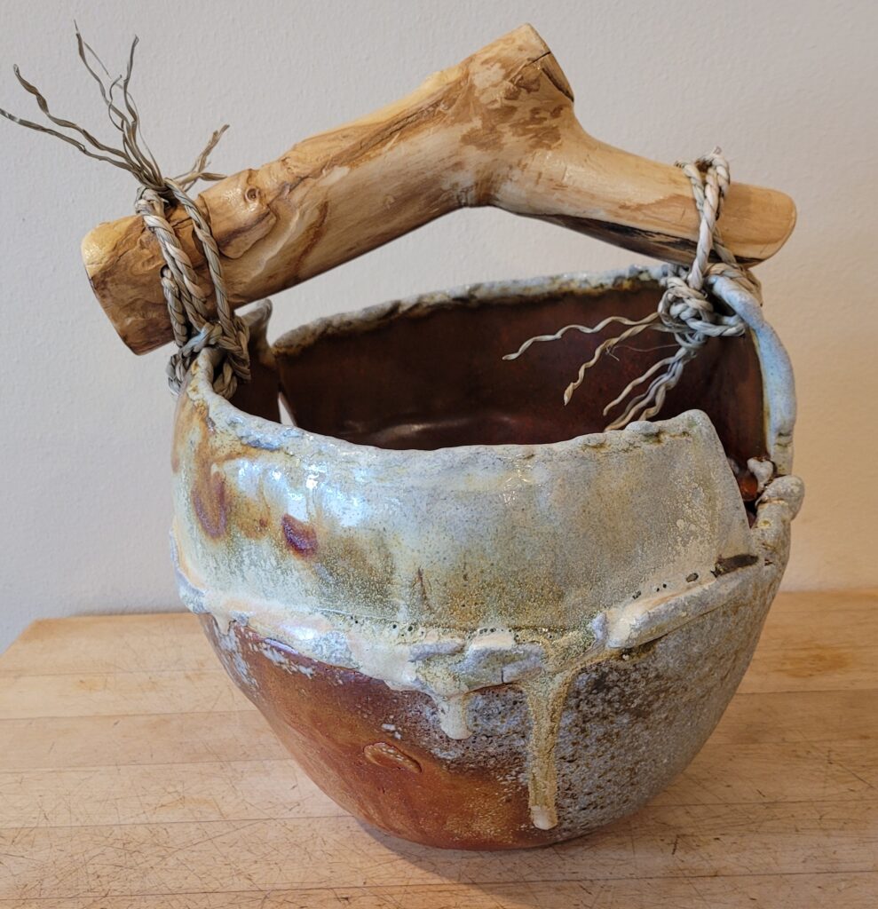 Ceramic vessel with Boxelder handle